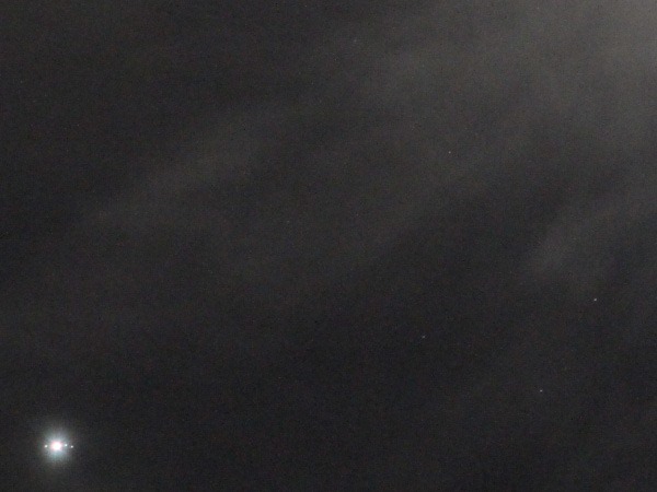 Photo of Jupiter and moons through the clouds